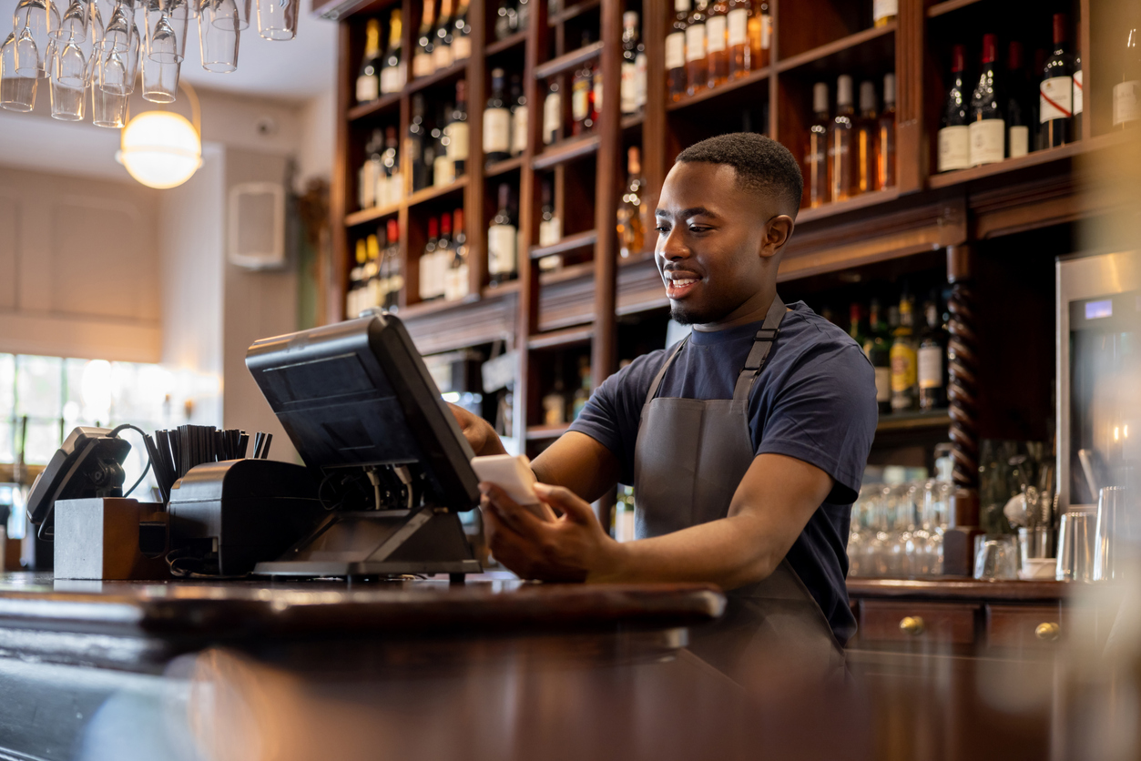 Business Owner with a POS system